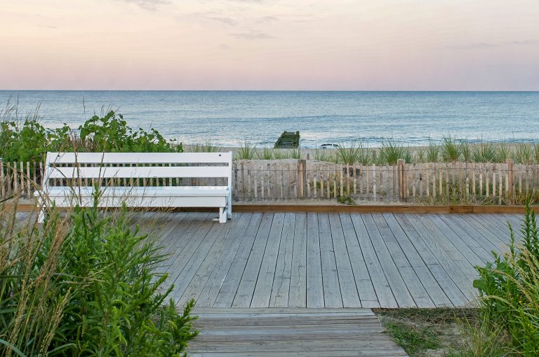 boardwalk bench and sunset